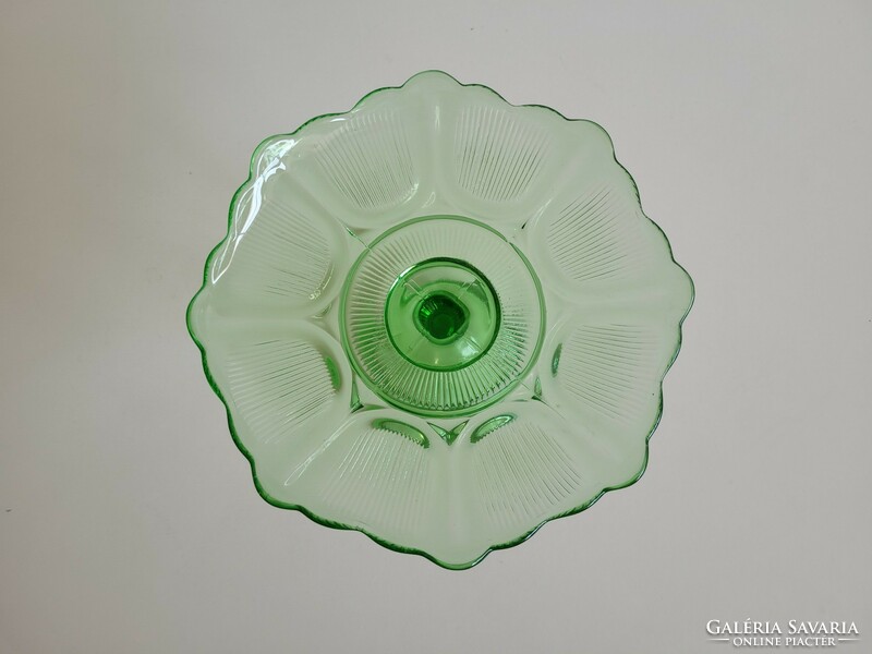 Vintage bowl serving fruit in old stemmed green glass bowl