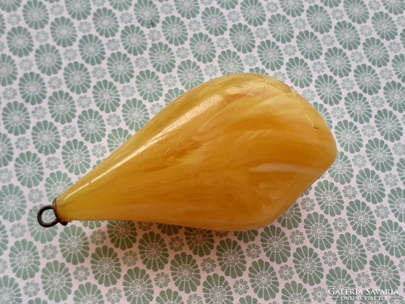 Old female plastic pendant in the shape of a drop