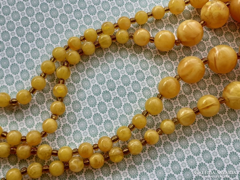 Old women's necklace with yellow plastic retro double row of pearls