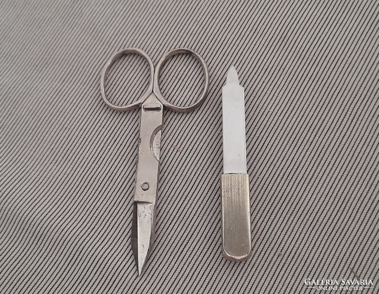 Vintage cigar pocket scissors, nickel-plated, with sleeve end.
