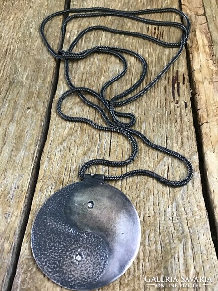 Old handmade yin and yang silver necklace with pendant and two brill stones.