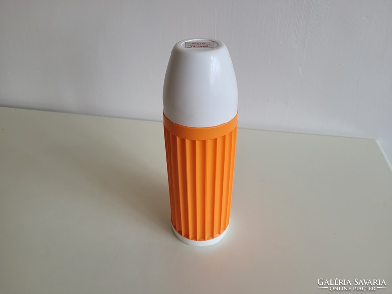 Old retro large size 0.75 liter orange thermos with glass insert