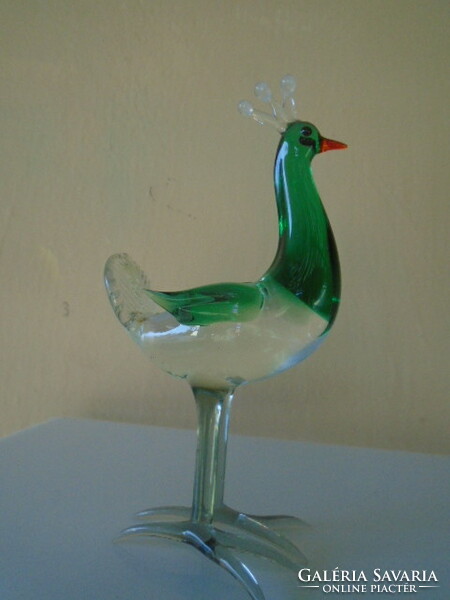 Murano's glass king peacock figure is not visible, but it has a bluish color
