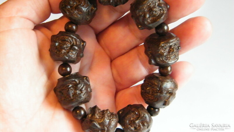 Hand carved Buddha head bracelet, made of wood.