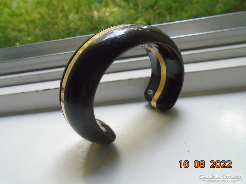 Elegant black lacquered wide, thick wooden bracelet with a gilded copper strip