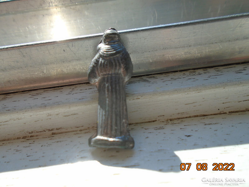 A souvenir from the Polish pilgrimage site of Jasna Góra in a sacred antal metal mini figurine in a book-shaped holder