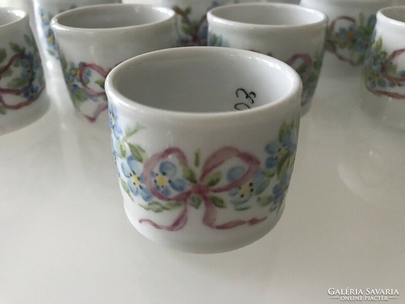 Porcelain napkin rings, each piece hand painted and signed