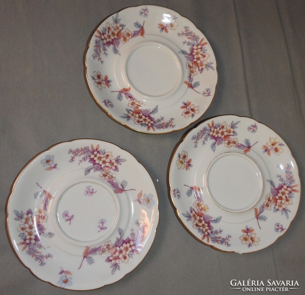 Antique set of three coasters with a rose pattern