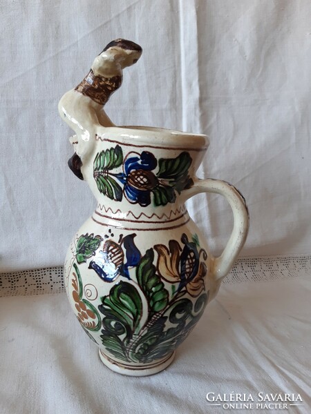 A rare Korund bait jug with a female figure