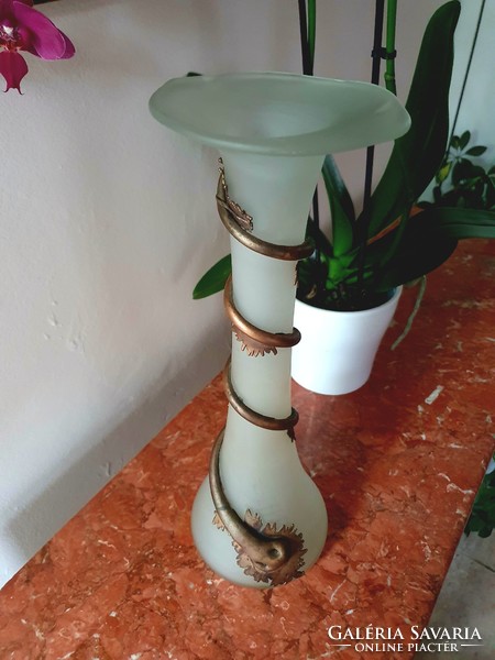 Broken vase with copper decoration