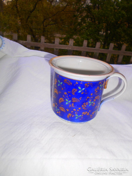 Antique large thick porcelain strainer mug