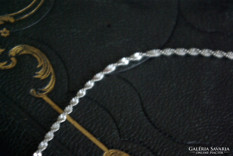 Silver twisted necklace.