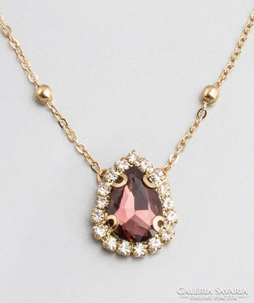 Drop-shaped, burgundy red crystal pendant, with small white crystals, gold-colored chain.