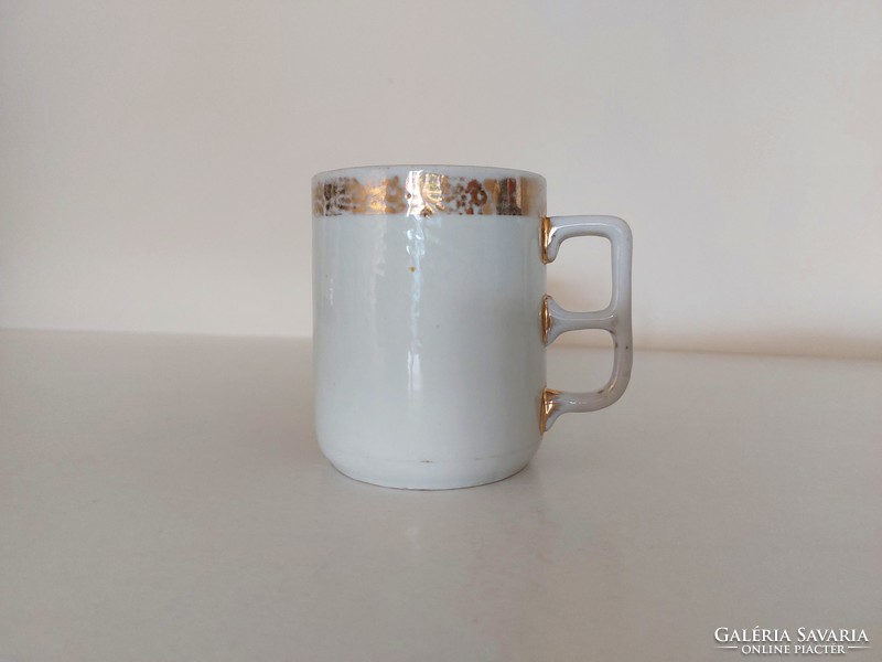 Old gilded vintage white porcelain mug art nouveau tea cup