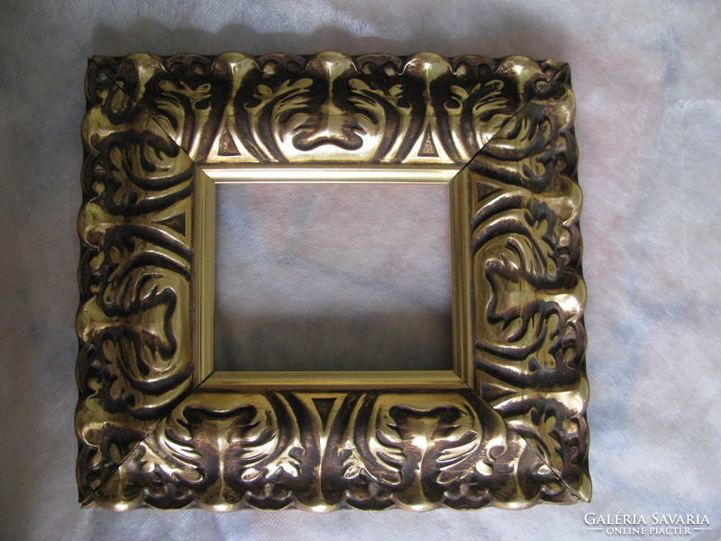Wide, gilded picture frame
