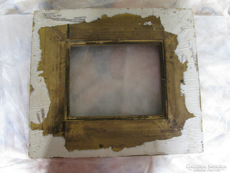 Wide, gilded old picture frame