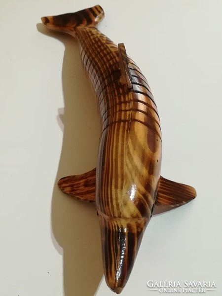 Handmade dolphin with moving body and tail.
