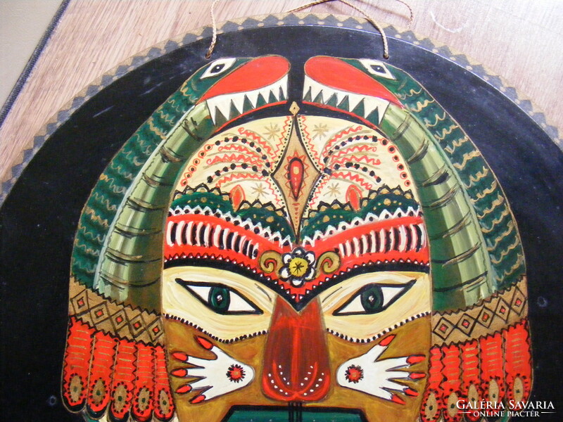 Image of an Aztec Mayan mask painted on wood