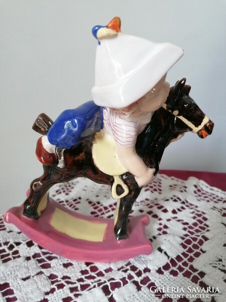 Retro ceramic little boy with rocking horse