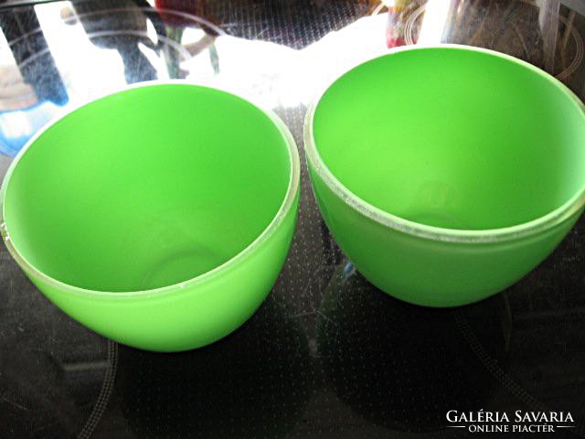 Layered green and transparent glass pots in bowls in pairs