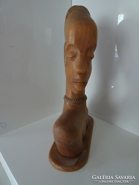 African female head on a tree.