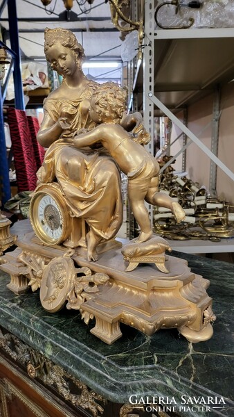 Fire-gilt bronze Empire mantel clock with candle holders