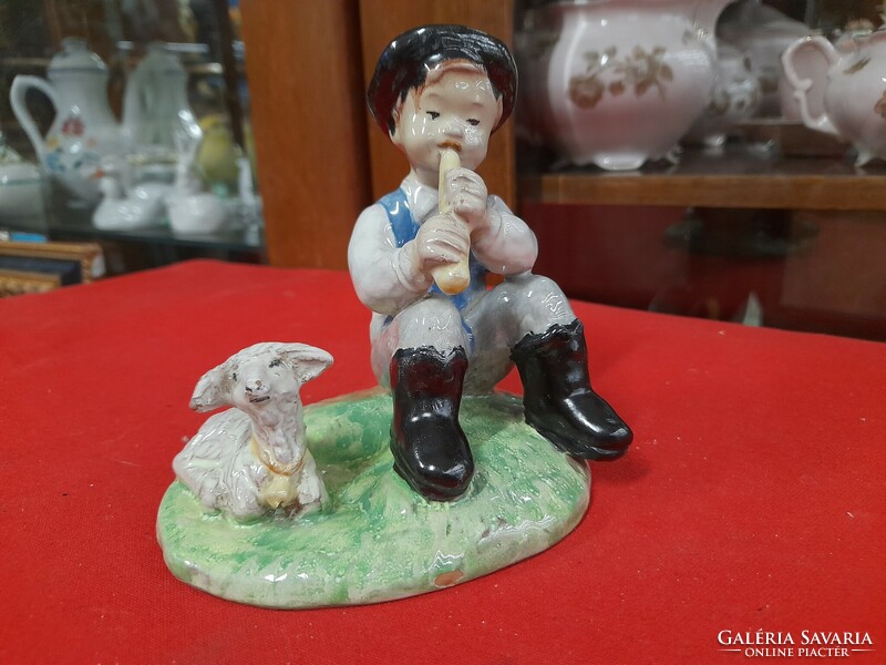 Izsépy ceramic figure of a boy playing a flute with a lamb.