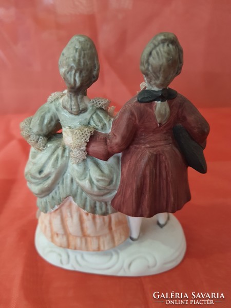 Antique porcelain love figurine with lace