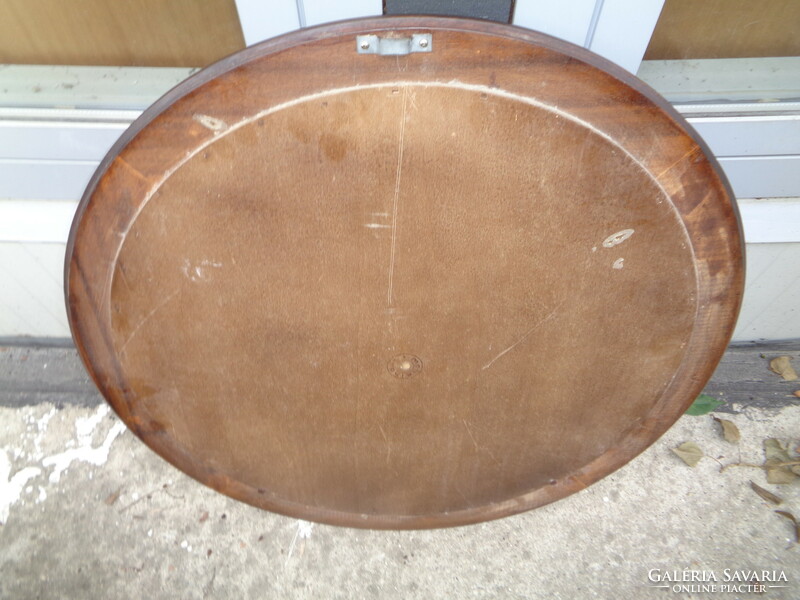 Round mirror, in a wooden frame