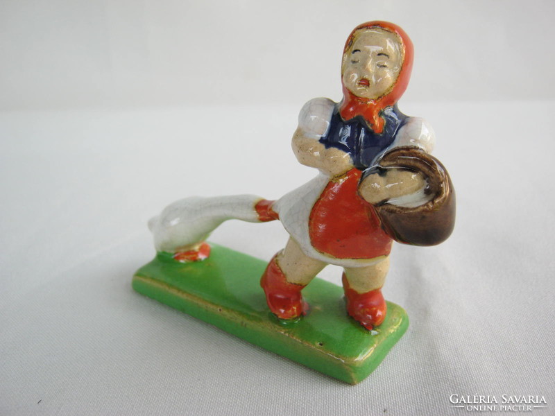 Folk ceramic girl with a goose
