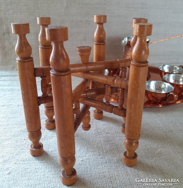 Beautiful red copper coffee set in mint condition on a folding decorative wooden table