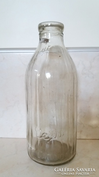 1 liter milk bottle with old milk bottle labeled milk