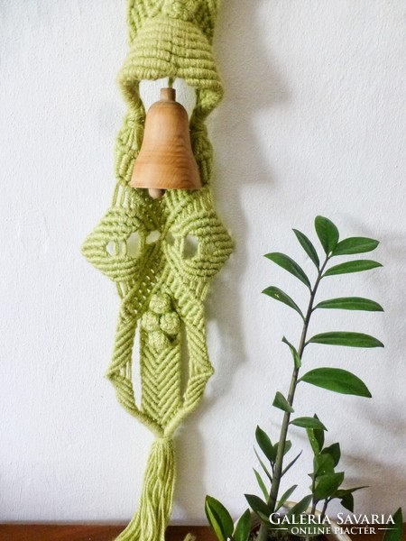 Retro macramé wall decoration with wooden bells