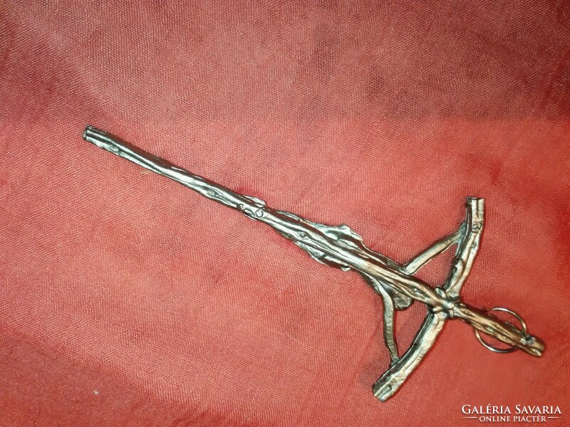 Antique small crucifix cast from lead.