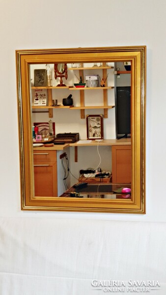 In old gold-colored frame, new mirror. 63 X 80 cm.