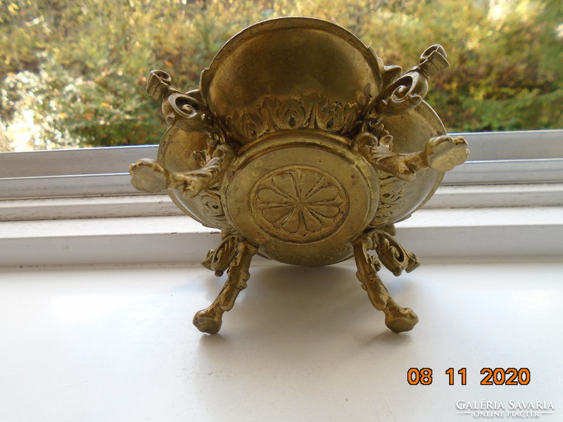 18 S rococo plastic putto with face, fire-gilded bronze bowl, with decorative tongs, on goat legs