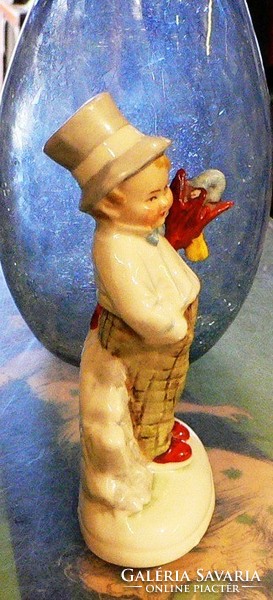 Germany porcelain. Little boy in hat with umbrella