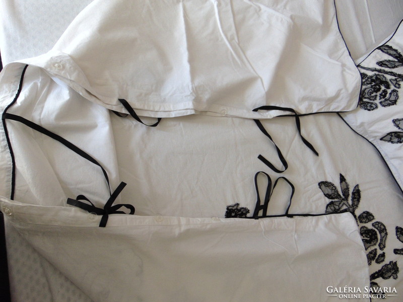 Beautiful cotton bed linen with lace roses and silk ties