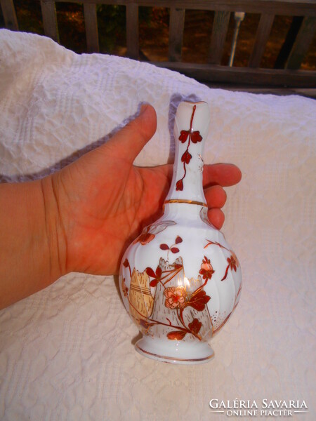 Antique hand-painted porcelain carafe with a traditional oriental pattern