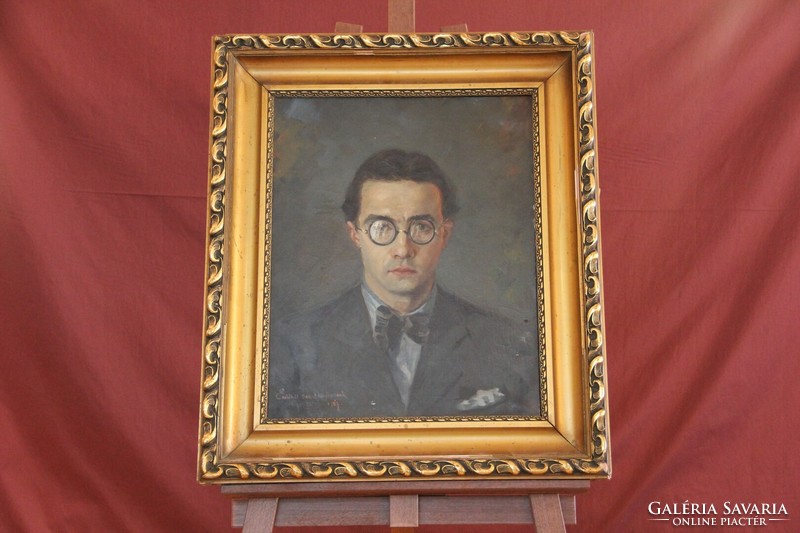 István Nagy with sign - male portrait