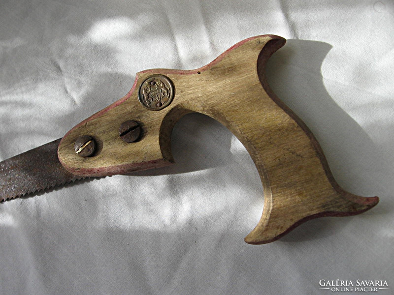 Old, large, marked, beautiful hand saw