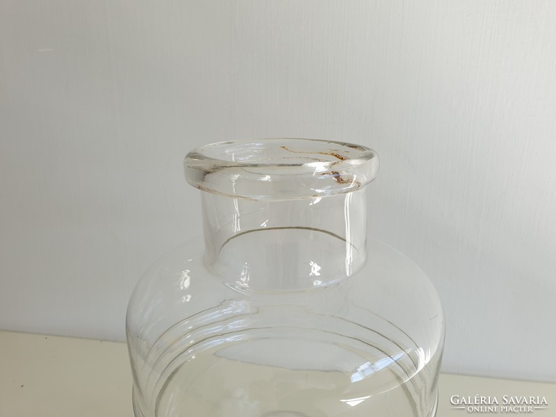Old vintage mason jar in the shape of a 6 liter striped convex patterned barrel