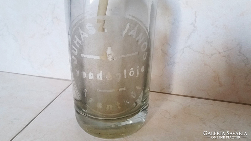 Old soda bottle in the restaurant of John the Shepherd with a soda bottle inscribed with a holy well
