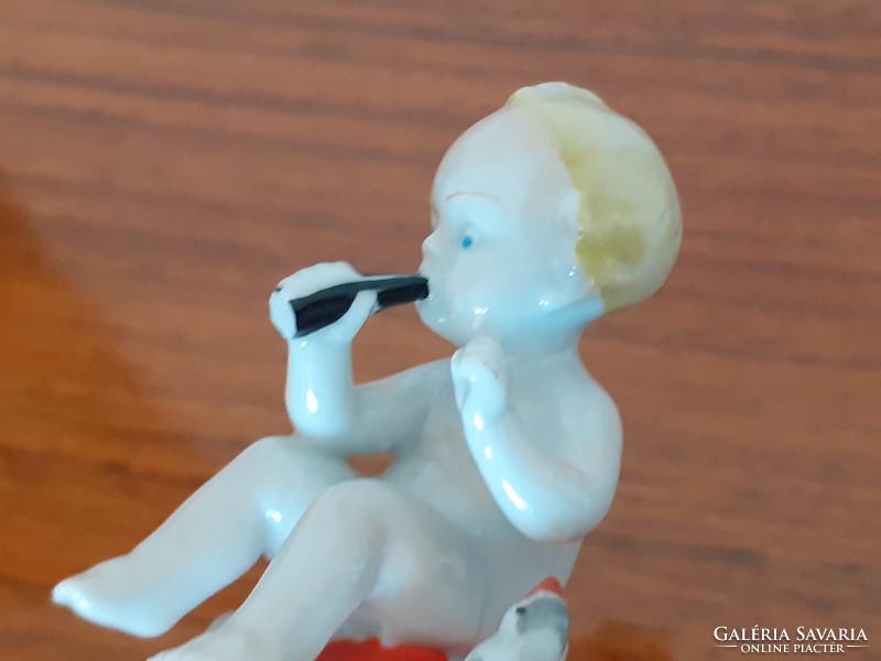 Régi Metzler & Ortloff miniatűr porcelán gombán ülő baba