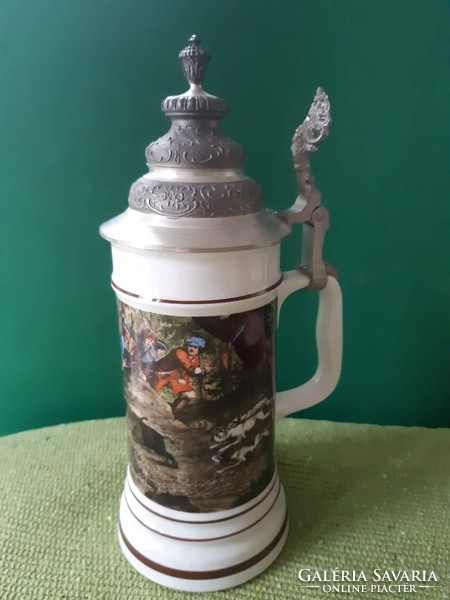A tin-ceramic jug in very good condition.