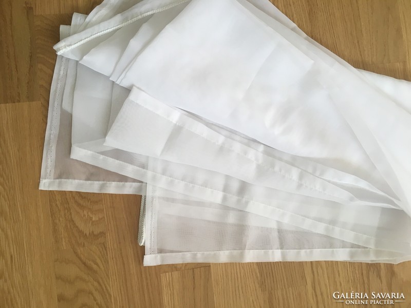 Plain white voile curtain fabric with hemmed sides (9.)