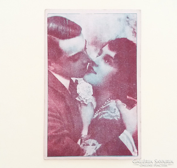 Old postcard circa 1920. Photo postcard of a couple in love