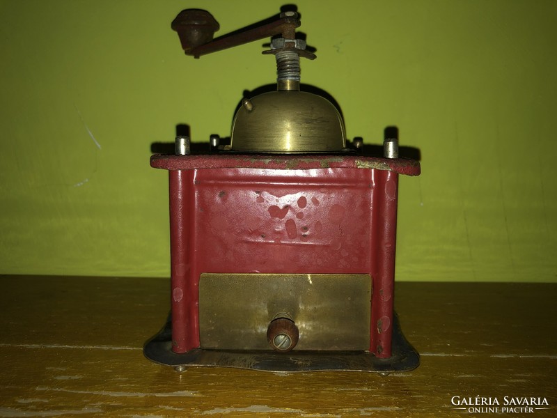 Old metal coffee or spice grinder in good condition.