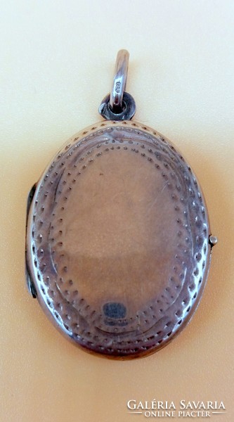 Antique silver photo pendant with engraved decoration