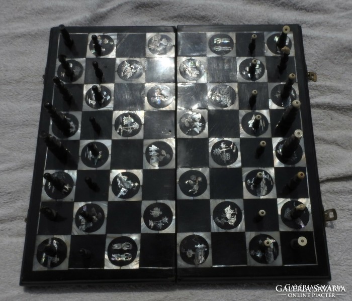 Antique oriental chess set with pearl board with bone-shaped wooden figures